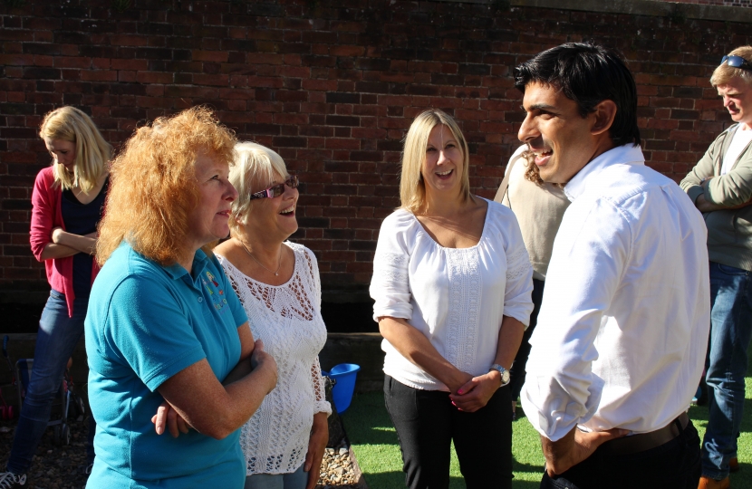Rishi Sunak talks to parents and supporters at the Rooftops opening