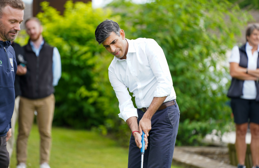 Rishi Sunak practices his putting at Richmond Golf Club