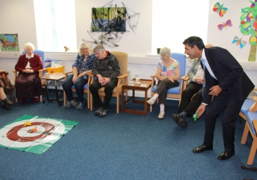 Rishi Sunak plays a game with attendees at the Bluebell House day centre
