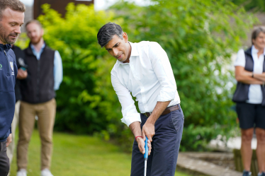 Rishi Sunak practices his putting at Richmond Golf Club